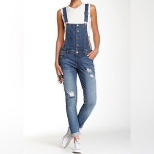 Distressed look denim bib overalls skinny jeans